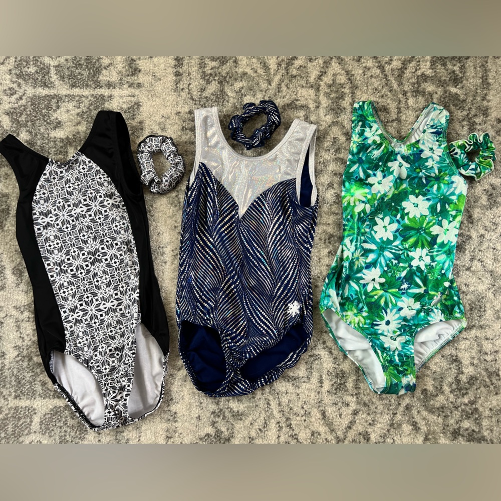 Three Snowflake Designs gymnastic leotards w/ matching scrunchies.